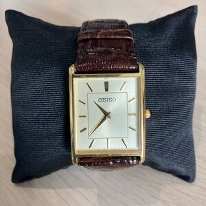 Seiko Essentials Quartz Watch gold bezel, champagne dial, leather SWR064P1
